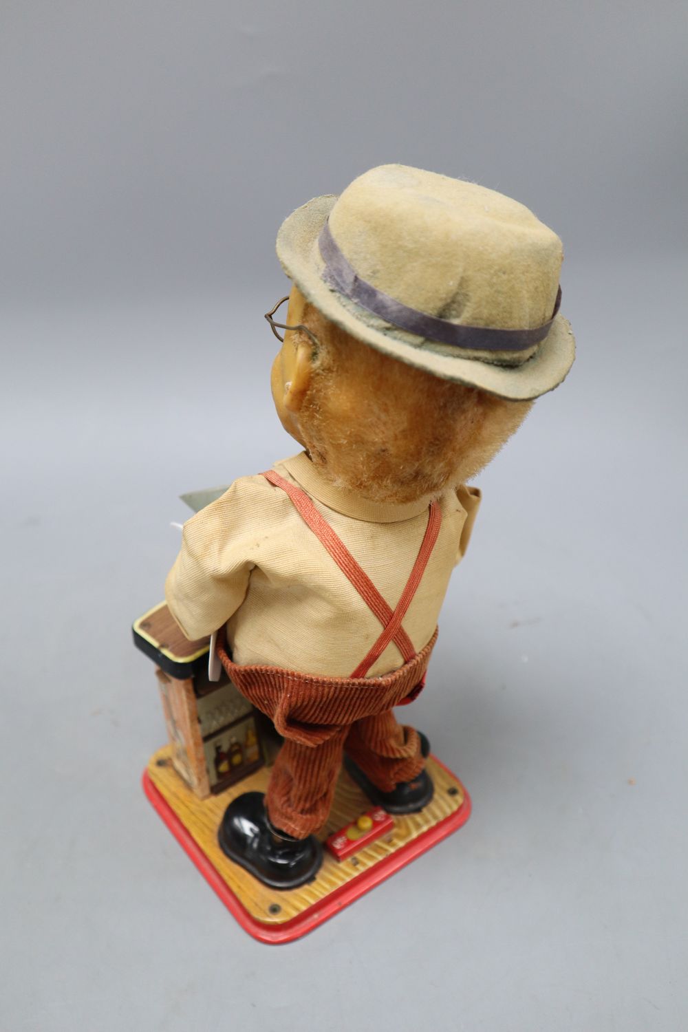 A Charlie Weaver bartender tin battery operated toy